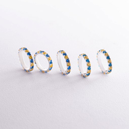 Серебряное кольцо с дорожкой голубых и желтых камней 112664 6
